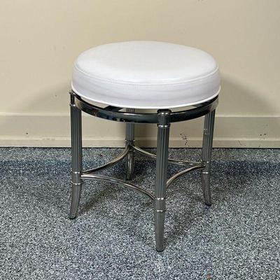 FRONTGATE LEATHER & CHROME STOOL  |
Vanity stool with a swivel leather top on a chrome frame with outside feet - h. 21 x dia. 18 in.