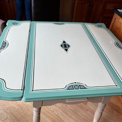 adorable 1920s kitchen table with a painted wooden base and Art Deco enameled metal top with 2 leaf extensions in turquoise and white