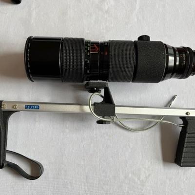 Canon AE-1 35mm camera with 50mm lens, Canon EF 80-200mm zoom lens; Vivitar zoom 120-600mm lens, rifle stock for large zoom lens