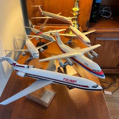 a collection of vintage model jet airplanes from various airlines, including Flying Tigers and Trump Shuttle