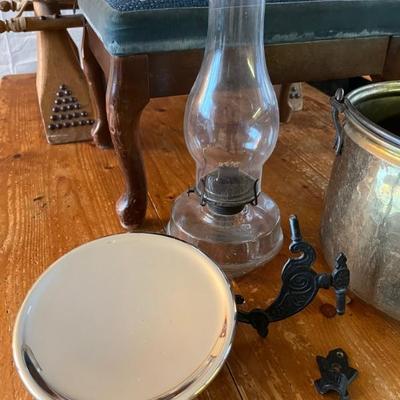 antique oil lamp with cast iron wall mount and mercury glass reflector