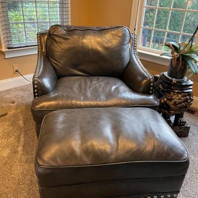 Black leather chair with silver nail heads with ottoman