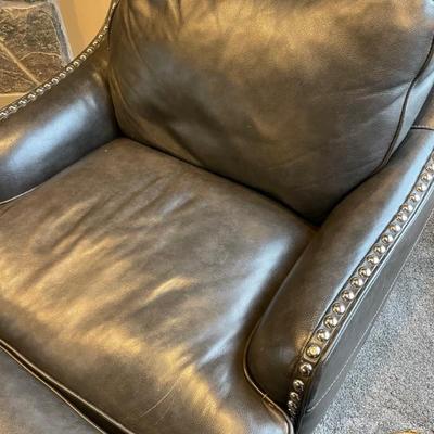 Black leather club chair with silver nail heads