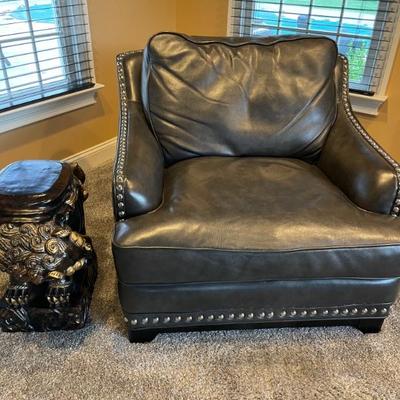 Black leather club chair with silver nail heads