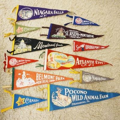 1045	LOT OF 12 VINTAGE ASSORTED PENNANTS, LARGEST IS APPROXIMATELY 26 IN LONG
