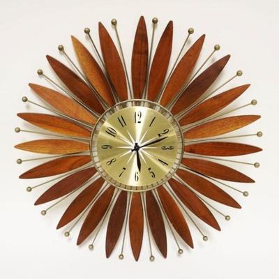 1015	MIDCENTURY MODERN WALL CLOCK FLANKED BY MAHOGANY WOOD SURFBOARD SHAPED PIECES & METAL RODS W/SPHERES AT TOP, APPROXIMATELY 20 IN
