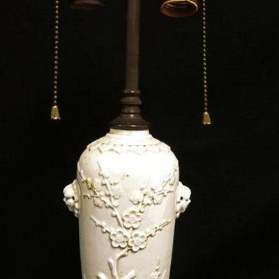 1016	ASIAN POTTERY TABLE LAMP W/RELIEF FOO DOG PROFILES & FLOWERING TREE BRANCH W/BIRD, APPROXIMATELY 19 IN HIGH
