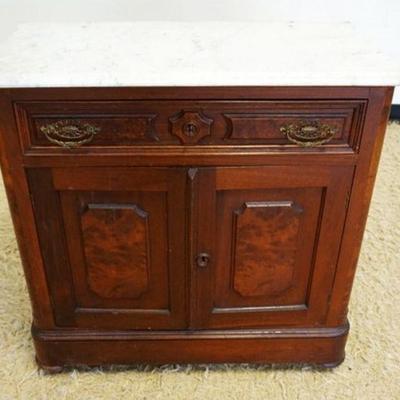 1275	VICTORIAN WALNUT MARBLE TOP WASH STAND WITH BURL MEDALLION PANELED DOORS, MISSING BACK SPLASH, APPROX IMATELY 31 IN X 17 IN X 32 IN H
