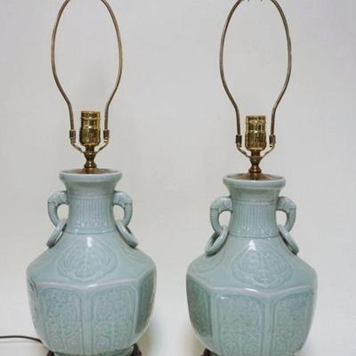 1018	PAIR OF CELADON TABLE LAMPS W/ELEPHANT HEADS & RINGS ON ORNATE WOOD BASES, APPROXIMATELY 27 IN HIGH
