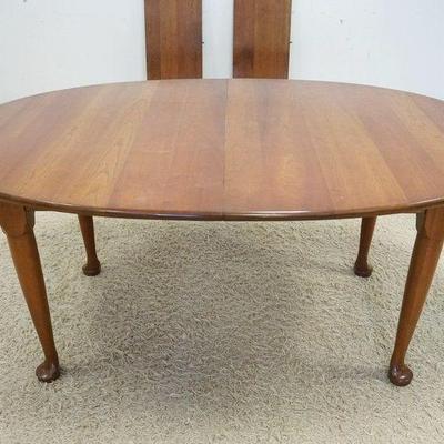 1219	SOLID CHERRY STICKLEY OVAL EXTENSION TABLE WITH 2 LEAVES, TABLE APPROXIMATELY 67 IN X 45 IN X 30 IN, LEAVES 15 IN
