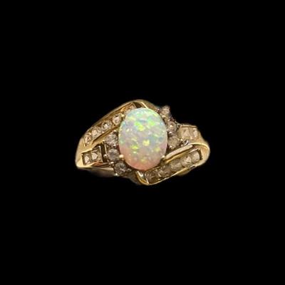 Oval Opal With Diamonds On Both Sides Of The Marked 10k