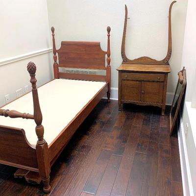 One of two antique twin size poster beds