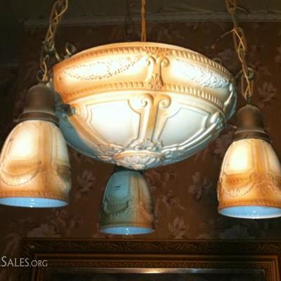 Antique light fixture; one large globe, three smaller.