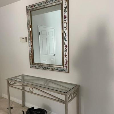 Console table & nice ornate mirror.