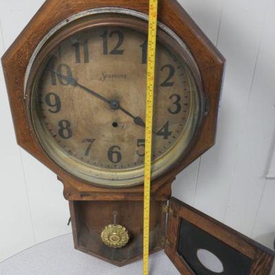 Small antique regulator clock, complete except key.