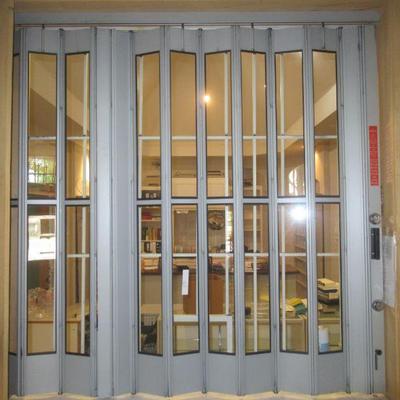 ACCORDION STYLE SECURITY WINDOW AND SECURITY BARS ON REVERSE SIDE MEASURES 72 X 63 EXPERT REMOVAL REQUIRED