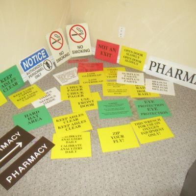 ASSORTMENT OF BUSINESS SIGNS