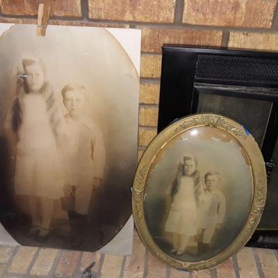 antique photos and a curved glass frame