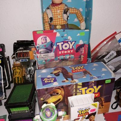 Vintage Toy Story Talking Woody, action figures, and a slinky dog.