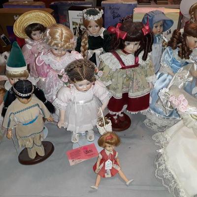many porcelain dolls