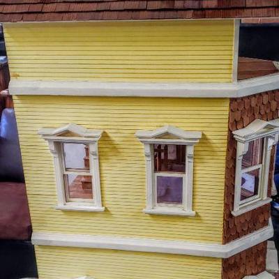 Large handmade wooden dollhouse with furniture & accessories.