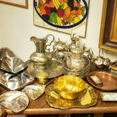 Tons of silver plate & pewter service pieces.