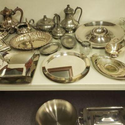 Tons of silver plate & pewter service pieces.