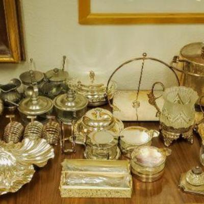 Tons of silver plate & pewter service pieces.