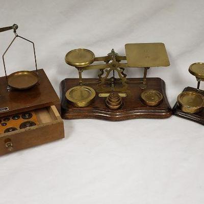 Antique brass scales with weights.