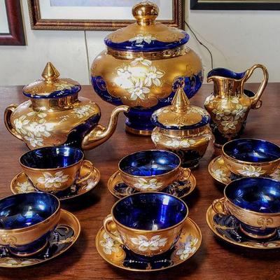 Stunning hand-decorated Bohemian blue glass with gold highlights tea set.