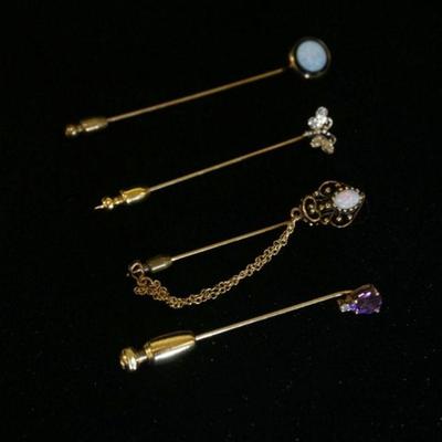 1024	GROUP OF FOUR 14K GOLD STICK PINS, INCLUDING ONE W/ AMETHYST STONE, ONE W/ ROUND OPAL & BLACK ONYX, ONE W/ OPAL & ONE BUTTERFLY....