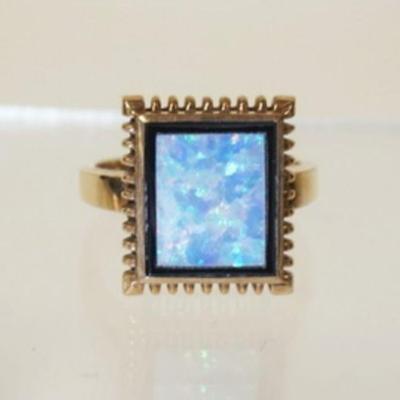 1108	10K YELLOW GOLD RING W/ ONE RECTANGULAR SHAPED INLAID OPAL DOUBLET. WEIGHT INCLUDING STONES 2.8 DWT. RING SIZE APP. 6 1/4 
