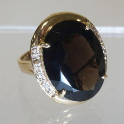 1030	14K YELLOW GOLD RING W/ GENUINE OVAL CUT SMOKEY QUARTZ & FIVE DIAMONDS WEIGHING APP. 0.03 CARATS, ONE DIAMOND IS MISSING. TOTAL...