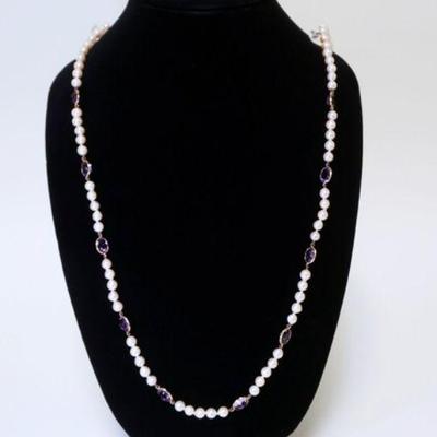 1006	CULTURED FRESHWATER PEARL NECKLACE W/ TEN GENUINE OVAL CUT AMETHYSTS. NECKLACE APP 35 IN LONG
