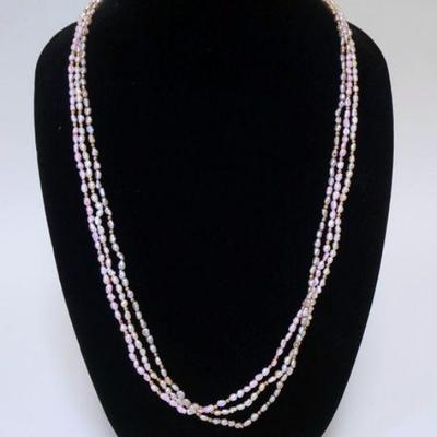 1020	THREE STRAND CULTURED FRESHWATER PEARL NECKLACE.
