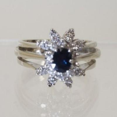 1121	14K WHITE GOLD RING W/ ONE ANTIQUE CUSHION CUT GENUINE BLUE SAPHIRE & 18 ROUND DIAMONDS WEIGHING APP. 0.35 CARATS
