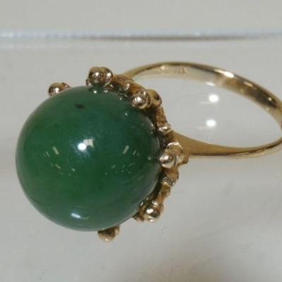 1031	14K YELLOW GOLD RING W/ GENUINE NEPHRITE JADE BEAD. TOTAL WEIGHT INCLUDING STONES 5.6 DWT. RING SIZE APP 6 1/4
