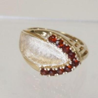1115	14K YELLOW GOLD RING W/ 9 ROUND GENUINE GARNETS TOTAL WEIGHT INCLUDING STONES 3.65 DWT
