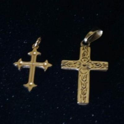 1073	TWO 14K YELLOW GOLD CROSS PENDANTS. COMBINED WEIGHT 0.60 DWT
