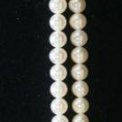 1048	14K YELLOW GOLD DOUBLE STRAND OF 68 CULTURED SALT WATER AKOYA PEARLS, CLASP CONTAINS TWO PEARLS & TWO ROUND DIAMONDS WEIGHING APP....