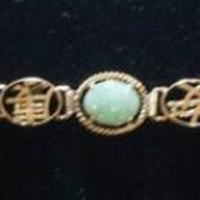 1047	14K YELLOW GOLD BRACELET W/ NINE MULTI COLORED STONES STONES APPEAR TO BE JADE, ONYX, & CARNELIAN. TOTAL WEIGHT INCLUDING STONES...