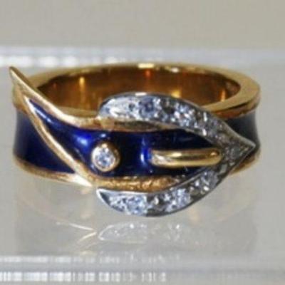 1013	18K GOLD & BLUE ENAMEL  BELT BUCKLE RING W/ EIGHT DIAMONDS WEIGHING APP. 0.04 CARATS. TOTAL WEIGHT INCLUDING ENAMEL/DIAMONDS IS 4.45...