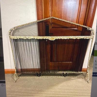 Heavy iron footed fire screen with cast brass overlay 
62Wx64H $350.00