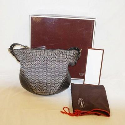 1055	VINTAGE COACH SIGNATURE BUCKET BAG WITH DUST COVER, BOX AND PAPERWORK. APPROXIMATELY 14 IN L X 13 IN H
