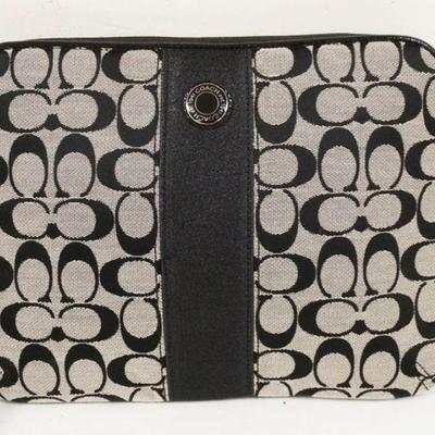 1003	COACH BLACK SIGNATURE IPAD OR FILE PURSE. APPROXIMATLEY 11 IN X 8 3/4 IN
