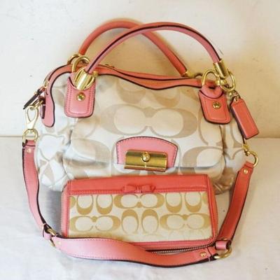 1025	COACH SIGNATURE BAG WITH PINK TRIM AND MATCHING WALLET. APPROXIMATELY 11 IN L X 8 IN H X 4 IN
