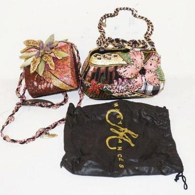 1009	2 MARY FRANCES DESIGNER BAGS ONE WITH DUST BAG. STRAP ON ONE BAG NEEDS TO BE REATTCHED
