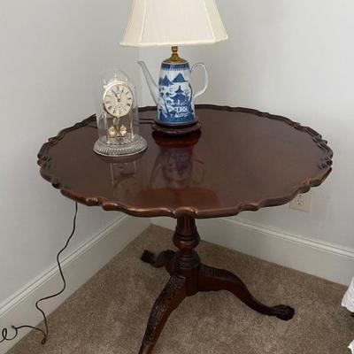 Antique ball in claw foot tilt top table