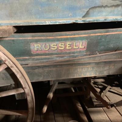 The green delivery wagon is complete in untouched, original condition. Made by the Russell Carriage Co., Clarksville, Virginia. It is...