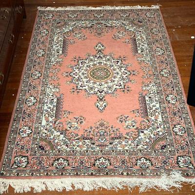 MEDALLION AREA RUG  |  Having a central medallion on a salmon ground with floral arabesque borders - l. 6.75 x w. 4.25 ft. (approx)